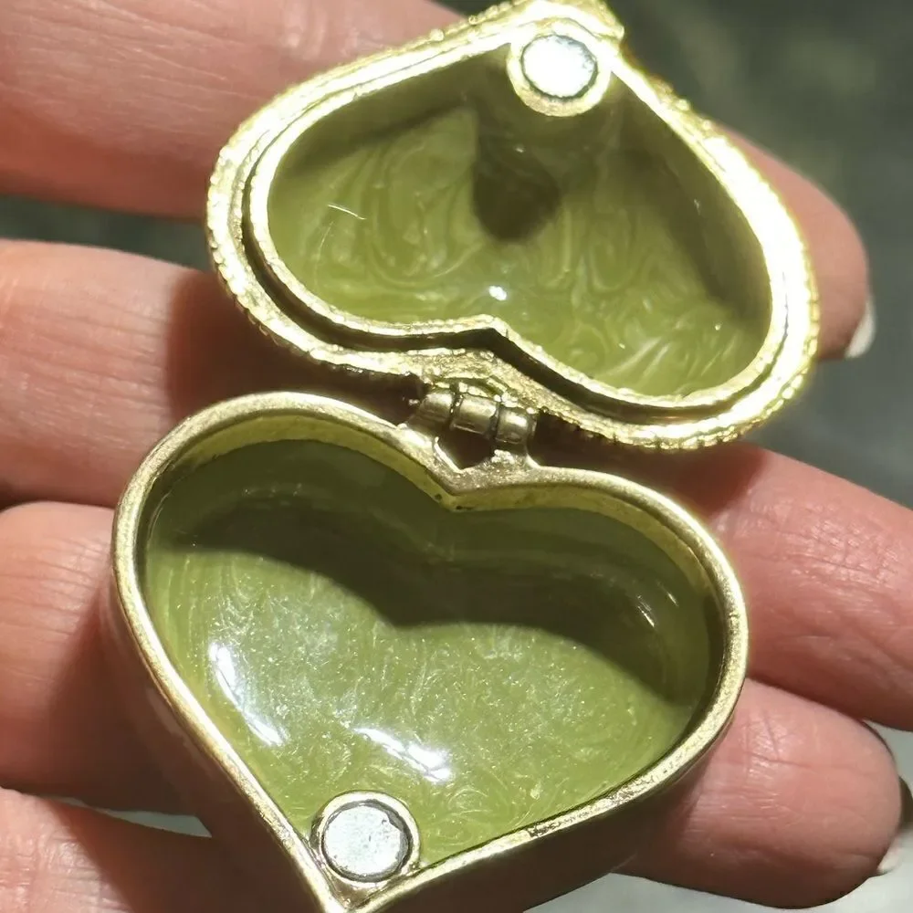 Small heart shaped trinket box marked Monet 2006 on the bottom